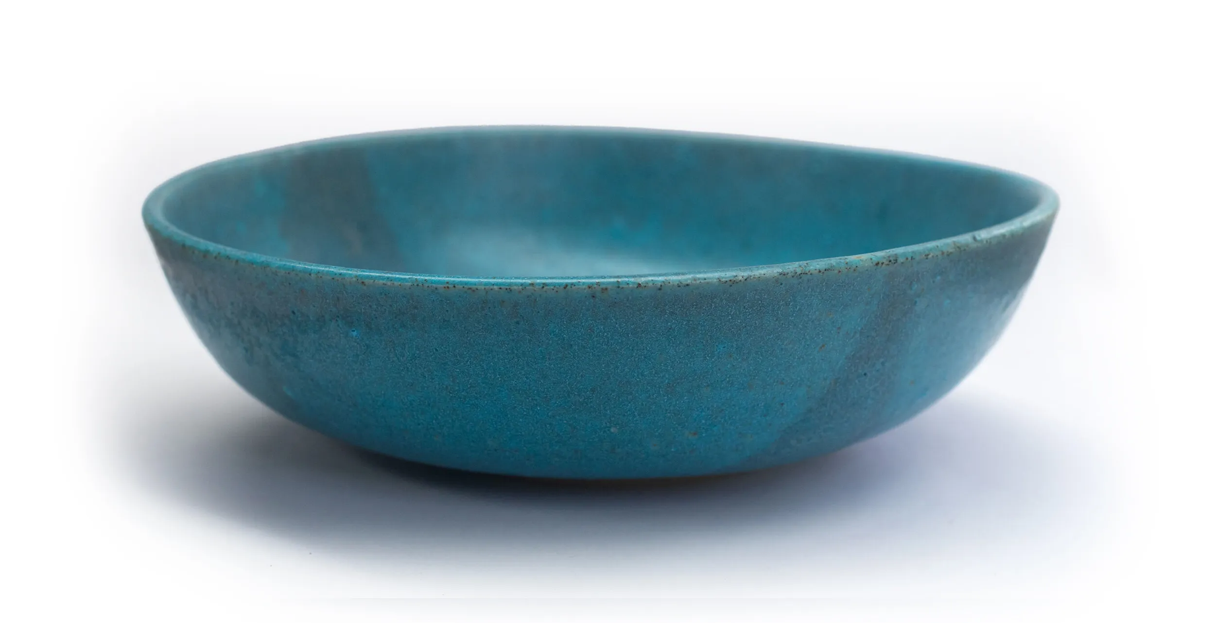 Hand-thrown turquoise ceramic bowl with a matte glaze